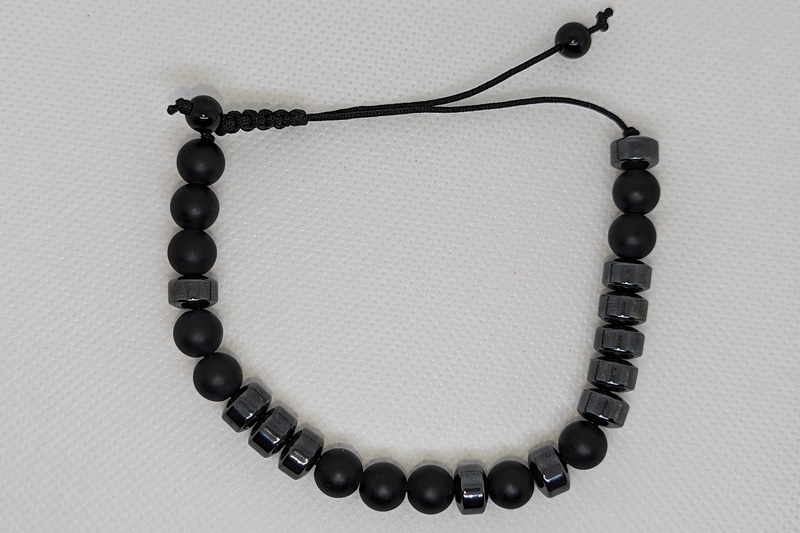 The bracelet, a sequence of beads described  below.
